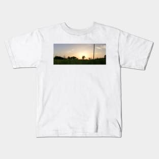 Sunset over the field Kids T-Shirt